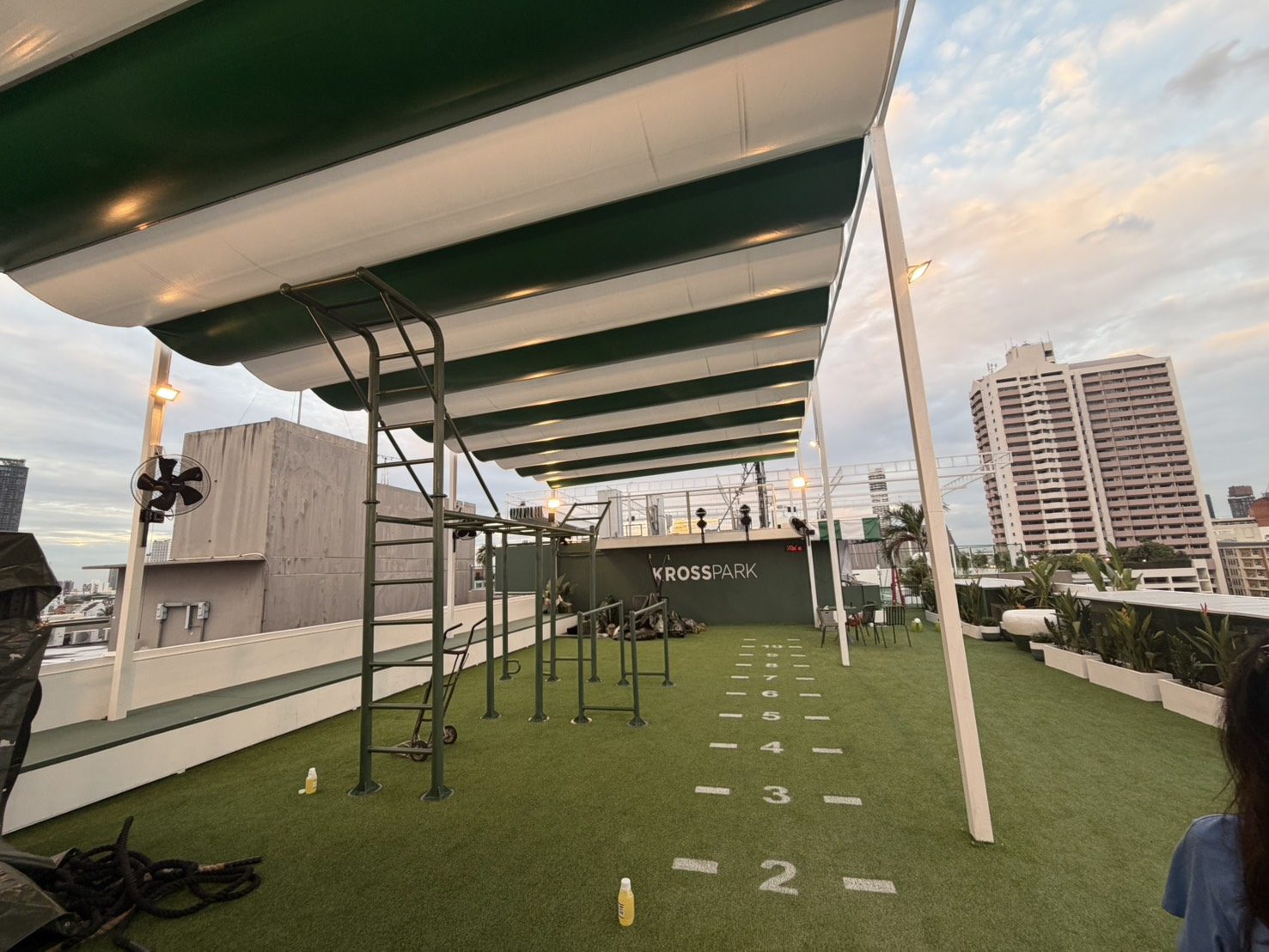 Outdoor strength park at KROSS PARK with monkey bars and sled track at sunset